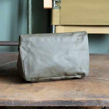 Olive drab canvas shoulder bag, front view with flap and two metal snaps
