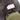 Electronic sound suppressor with rectangular control cover on gray strap, olive body