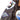 Brown leather flight jacket sleeve with COW-9 Top Ten patch and helmet artwork