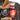Brown leather flight jacket with tan shearling collar and red Seabees patch