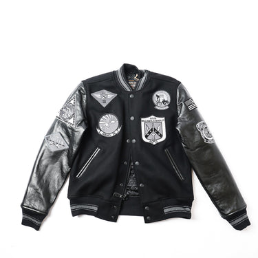 Black varsity leather jacket with ribbed collar, snap front, and embroidered patches