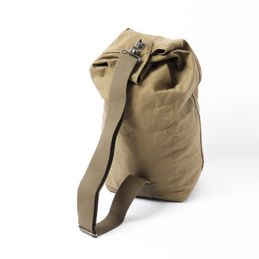 Beige canvas duffel bag with top clasp and adjustable shoulder strap