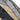 Close-up combat shirt sleeves with adjustable tabs and utility pocket details