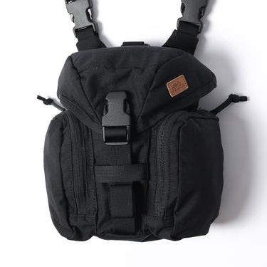 Black tactical kit bag with top flap, webbing straps, and two front zip pockets