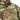 Multicam rain jacket close-up with zip front and logo badge on chest