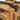 Pistol range bag close-up of top strap buckles and tan zipper compartments