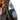 Brown leather flight jacket shoulder with triangular Jacksonville patch and round emblem