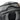 Grey backpack top handle area with black cord pull and textured fabric panel