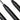Pin punch close-up with 4mm labels on textured black steel shafts