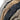 Softshell jacket close-up showing zippers on tan, navy, and gray layers