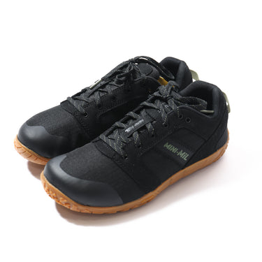 Black barefoot activity shoes with lace-up upper and green gum outsole