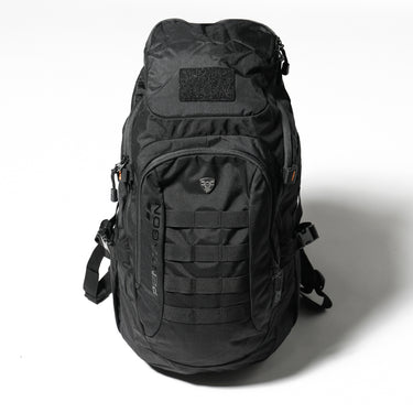 Black tactical backpack with MOLLE webbing front, padded back panel, top handle