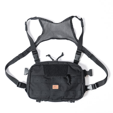 Small tactical chest pack, black fabric, front flap and MOLLE webbing