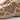 Tan boots with lace-up closure and rugged sidewall panels with angular tread blocks