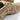 Tan tactical boots, close-up side view with protective overlays and deep outsole grooves