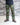 Green camo combat pants with cargo flap pockets, worn with boots