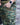 Green camo combat pants, side cargo pocket with hand near waistband