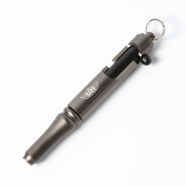 Tactical bolt action pen with gun metal body, black grip, and keyring.