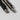 Tactical glassbreaker pens close-up: black and gunmetal with pointed tips and carry clips