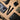 Black bolt-action tactical pen with textured grip and key-ring clip