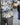 Rifle sling worn over a blue and white camouflage jacket