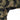 Windrunner windshirt in woodland camouflage, textured fabric at shoulder and cuff