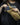 Tan Foxhole nylon sling bag worn crossbody with webbing straps and side buckle