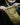 Tan nylon Foxhole bag with front pocket panel and adjustable webbing strap