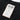 Close-up of RTB fabric label on black T-shirt collar area