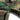 Woodland camouflage shorts with drawstring tie at the hem