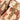 Camouflage rifle bag front flap with zipper track and tan buckled strap