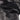Black flight jacket fabric panel with patch detail