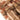 Rifle bag with tan webbing straps, buckle details, and camouflage fabric paneling