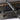 Black torque wrench with copper sockets and driver bits arranged in tray