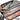 Compound bow bag, open, gray interior, black shell, orange trim