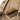 Tan assault pack back with AGILITE label and suede-style Velcro patch
