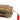 Close-up of tan fabric trauma pouch with webbing strap, small red triangle accents, and seam stitching