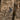 Combat shirt chest close-up in desert camouflage, dark utility pocket with straps