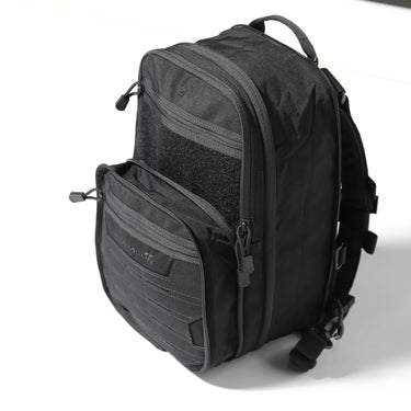Black quick backpack with side zip pocket and padded shoulder strap webbing