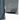 Light gray-blue softshell jacket cuff with logo tab and dark inner hem