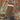 Flecktarn jacket seam with multicolor striped fabric label patch