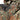 Flecktarn camo rain jacket close-up with hood drawstrings and snap pockets