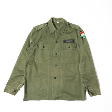 Olive drab field jacket with button front and two flap chest pockets
