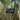 Poncho fabric label on olive green camouflage showing 'PONCHO' and care icons