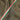 Olive drab fabric with red and green stripe trim along side seam