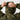 Lightweight camo field jacket with zip front and adjustable hood, shown being fastened