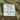 Woodland camo field shirt care label with size, fabric blend, and washing symbols.