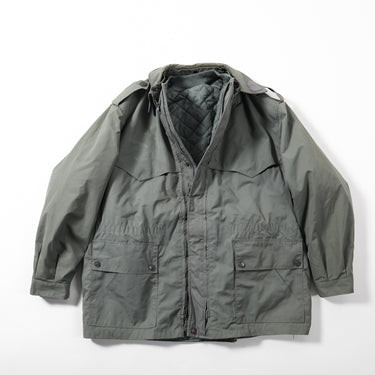 Grey military-style coat with hood, full zipper, flap pockets and button details