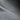 Close-up of grey fleece watch cap seam and stitched edge
