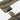 Camouflage chest panel corner with webbing strap and hook-and-loop patch